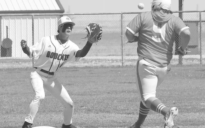 BOBCAT SHORTSTOP- Smyer shortstop Aiden Martinez got ready to tag Sundown’s Jeffrey Rodrigues in a 7-6 Smyer home win in UIL District 4-2A high school baseball action last Friday. Smyer will be in Post on Saturday while Sundown will host Tahoka. Both games are a 11 a.m. (Photo Courtesy of Jay Kelley)