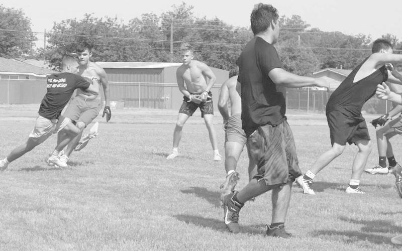 RUN OFFENSE- The Levelland Lobo offense worked on blocking and running the ball during summer workouts. Pictured running the ball is Ben Alverado. The Lobos will be at Lubbock High Monday, June 26 for seven on seven action. Game time is set for 5:30 p.m. (Staff Photo by Aalijah Soliz)