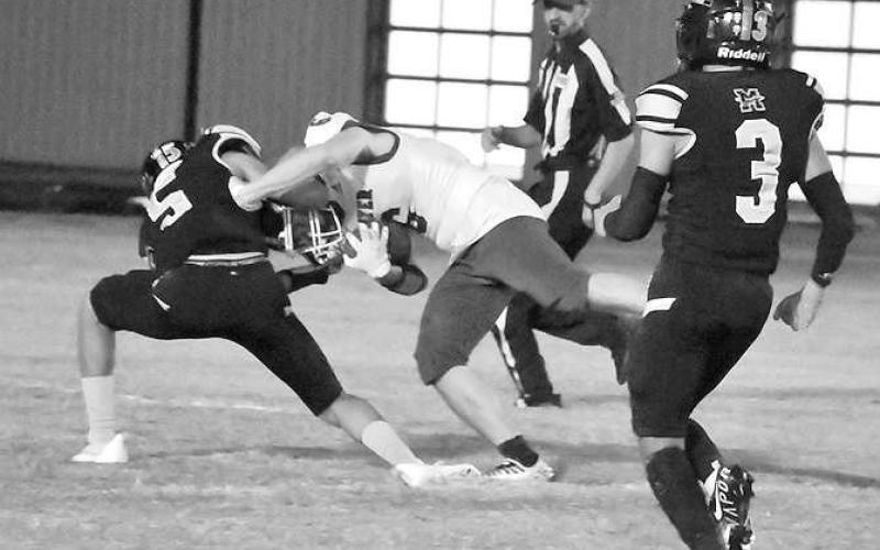 HARD TACKLE- Morton’s Alex Lopez took Smyer’s Preston Moore down in a rough and tumble 24-12 home loss for Morton in UIL high school football action last Friday. Morton will host New Home while Smyer hosts Seagraves Friday. Games start at 7.(Photo Courtesy of Jay Kelley)