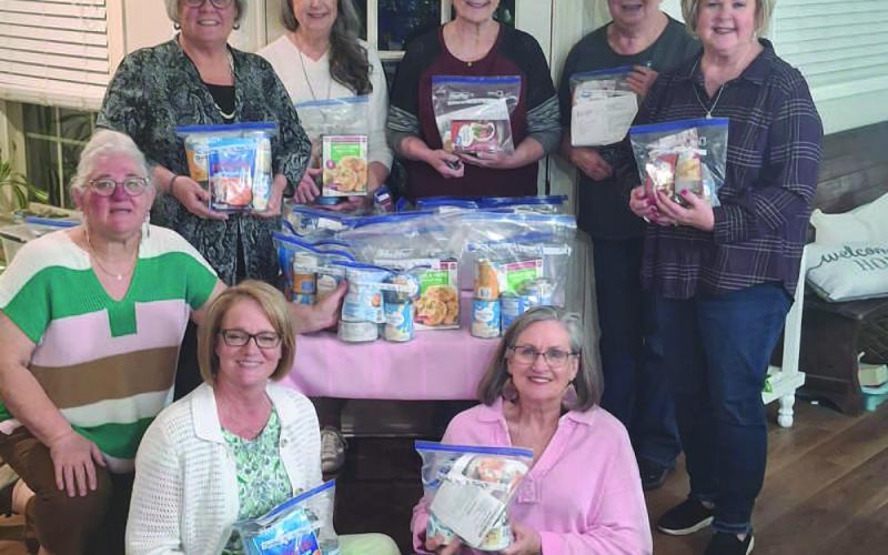 MEAL BAG BLESSINGS-- Xi Theta Pi members filled meal bags and delivered them to the Levelland Blessing boxes through town. The items delivered were made possible with proceeds from the Xi Theta Pi December quilt raffle. (Photo courtesy of Ann Capps)