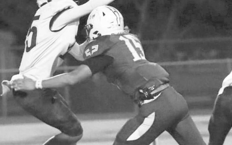 PRESSURE - Whiteface’s Auscar Gandara rushes the Wellman-Union quarterback in a 68-0 Whiteface home win last Friday in UIL District 3-1A1 high school football action. Gandara had a tackle and a sack in the effort. The Antelopes will travel to Meadow to take on the Broncos this Friday at 7:30 p.m. (Photo by Holly Crutcher)