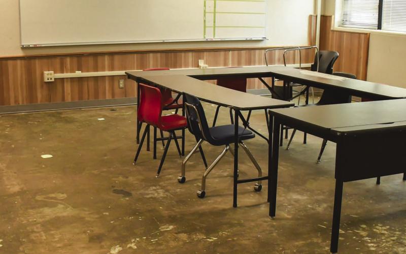 WATER DAMAGE - An intermediate school second-floor classroom with the carpet removed due to constant water leaks from the damaged roof during the intermediate school closure tour Monday. A district employee explained the smell coupled with the amount of water in the carpet made it necessary to remove. (Staff photo by Victoria Byrnes)