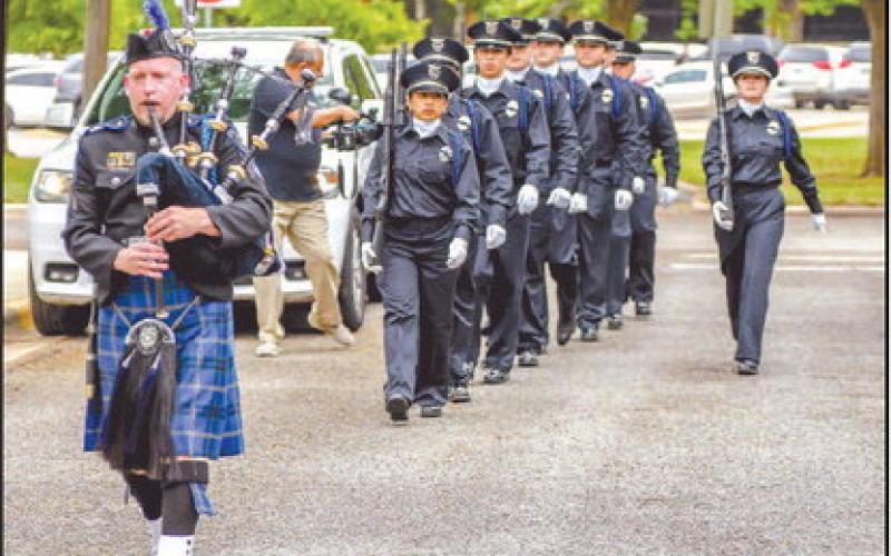 HONORINGFALLEN PEACE OFFICERS - South Plains College held their annual Peace Officer Memorial Service on April 30. Pictured is Michael Mogan of the Lubbock Airport Police Department playing the bagpipes and leading the SPC Law Enforcement Honor Guard to begin the service. (Staff photo by Dom Puente)