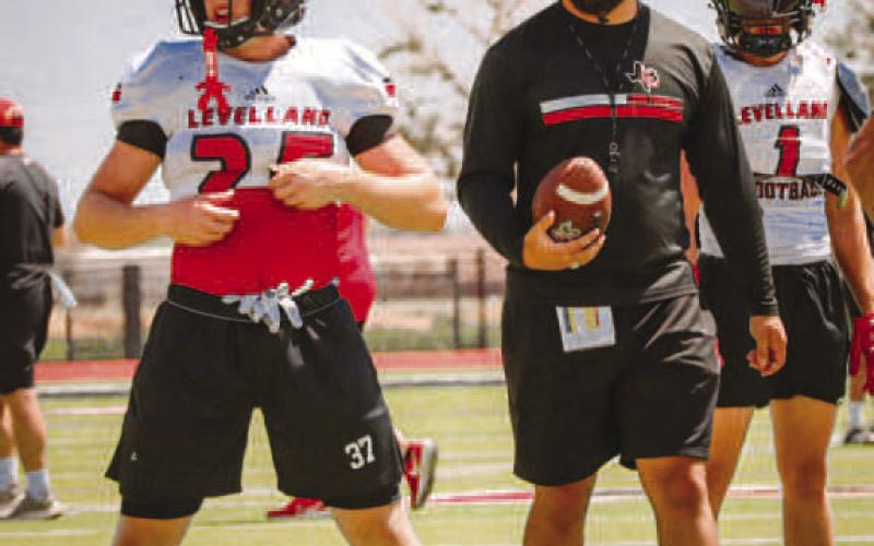 DRILLS - Levelland Coach Isaac Garza and Lobo Jackson Gibbs went over drills this past Thursday at Lobo Stadium during two-a-days practices. (Staff photo by Aalijah Soliz)