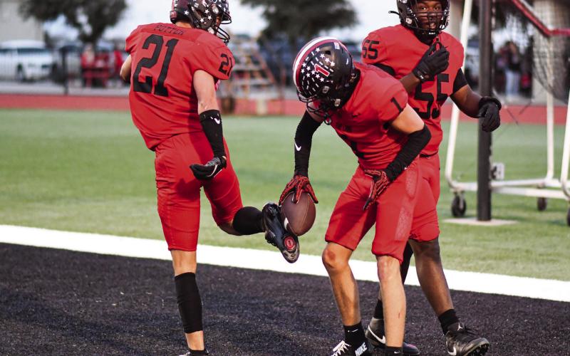 TD CELEBRATION - Senior Kaden Brogden celebrates his punt return touchdown with his junior teammate Jake Potter during Levelland’s Homecoming football game this past Friday night. The Lobos would go on to win 50-0. (Staff photo by Jentezen Smith)