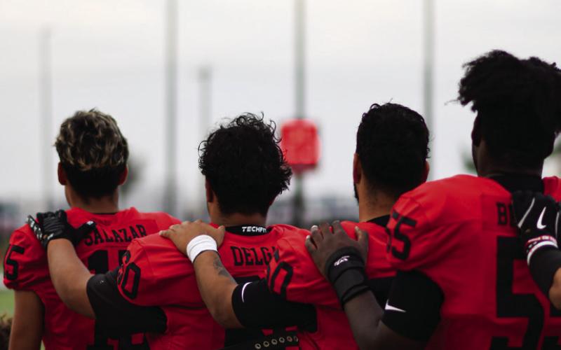 NATIONAL ANTHEM - The Levelland Lobos line up together for the National Anthem before their Homecoming game against Brownfield this past Friday. (Staff photo by Jentezen Smith)