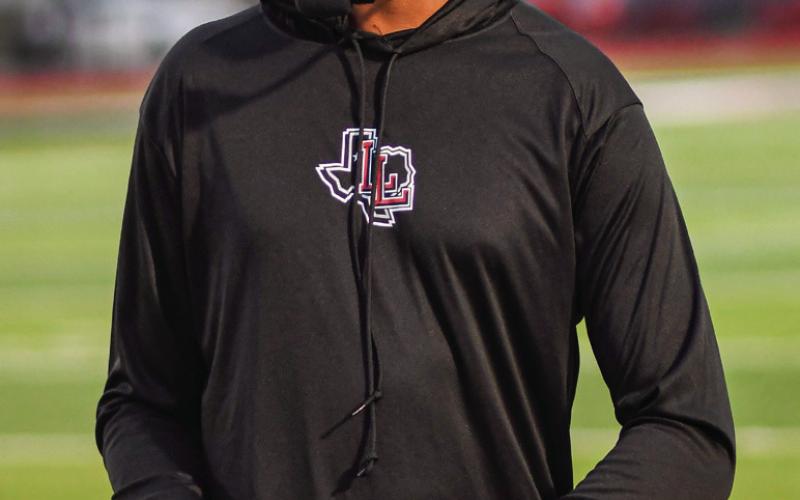 HAPPY HEAD COACH - Levelland football Head Coach Lyle Leong smirks during their Homecoming game against Brownfield this past Friday night. The Lobos would win 50-0. (Staff photo by Jentezen Smith)
