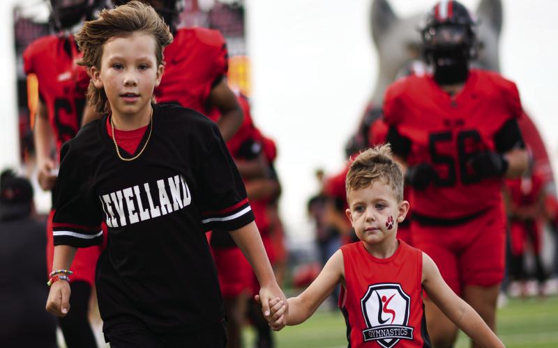 LITTLE LOBOS - The little Levelland Lobos take the field with the varsity football team for their Homecoming game this past Friday night. They would go on to win 50-0. (Staff photo by Jentezen Smith)