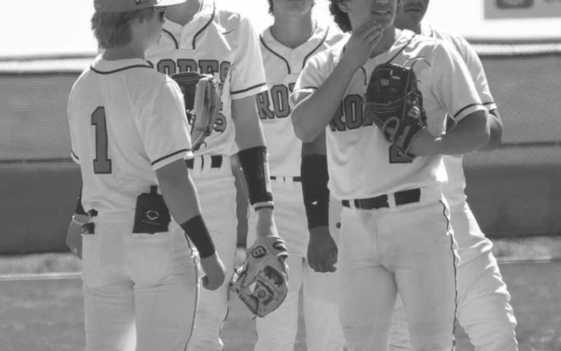 GAMEPLAN - Ropes Eagles gathered around the mound during the team’s game while listening to their coach last Thursday as they hosted the Sundown Roughnecks in their win. (Staff photo by Aalijah Soliz)