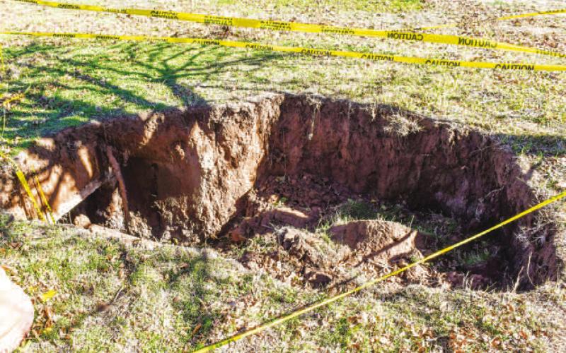 POSSIBLE SAFETY HAZARD - Whitharral homeowner John Dea shared that a sink hole formed on his property following the last heavy rainfall that swept across the area. Dea highlighted that the incident has happened within the area before and can be a potential safety hazard for those walking around the unsuspecting area. Property owners are encouraged to scan their area for possible signs of topsoil giving away following inclement weather. (Staff photo by Evin Thomas)