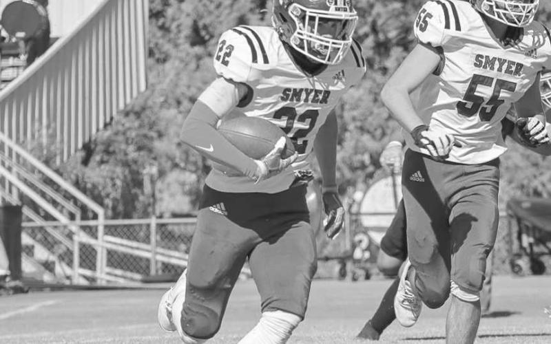OUTSIDE RUN - Smyer Bobcat Max Benevedes ran the ball to the outside on the team’s two-point conversion against the Plains Cowboys this past Thursday on the road. (Staff photo by Aalijah Soliz)