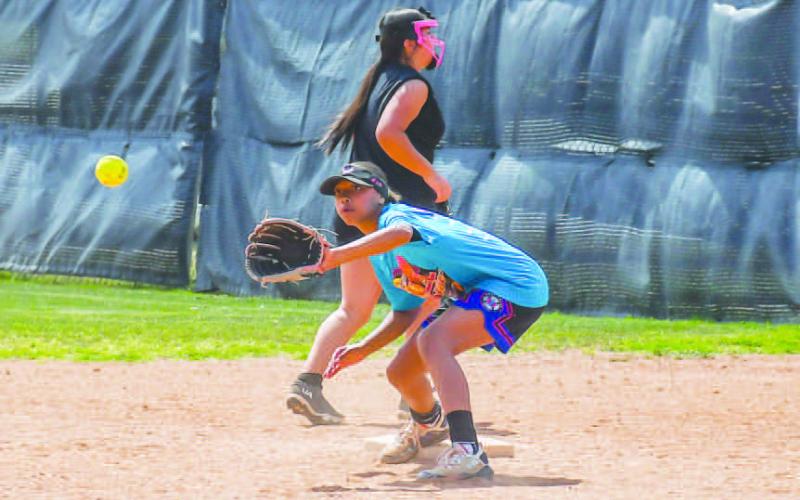 FOCUS AT FIRST – Laken Smith worked on making routine catches at first base. Smith took part in the summer clinic held by the Levelland High School Softball program. (Staff photo by Hannah Woodrum)