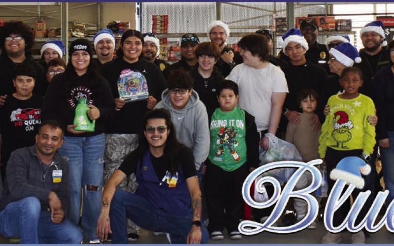 Pictured are participants in the Blue Santa event at Walmart on Saturday. The event started at the fire station where children got in police cars to be escorted to Walmart where police department personnel bought Christmas gifts for them. (Staff photo by Ada Niederhauser)