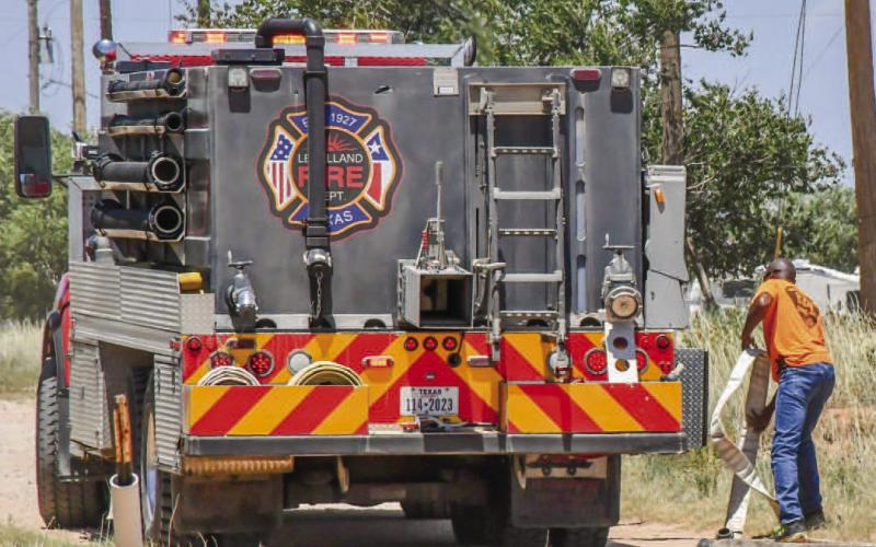 PIT FIRE - The Levelland Fire Department responded to a pit fire that had reached surrounding grass near Avenue X, Saturday. The department sent two grass trucks and a tanker to extinguish the fire. LFD Fire Chief Jay McKay reminded community members that outdoor burning can be dangerous with the extreme heat and low humidity. Hockley County is currently not under a burn ban. Community members are encouraged to reach out to the LFD to give notice of burning activity beforehand. (Staff photo by Jay Kelley)