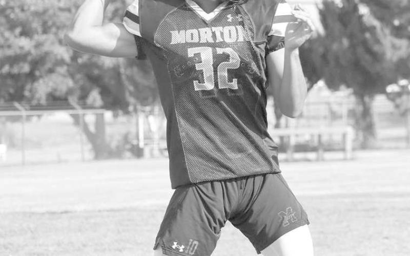 PRACTICE - Morton quarterback Dante Chavez threw to his teammates during team drills to show off his arm strength. (Staff photo by Aalijah Soliz)