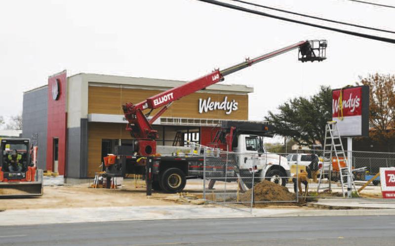 TAKING SHAPE - Progress continues for the construction of the Wendy’s restaurant which is located along College Avenue next to Prosperity Bank. Pictured is the updated exterior and signage of the restuarant that has been placed over the past week. The anticipated opening date for the location is mid-to-late January according to a recent social media post. (Staff photo by Evin Thomas)