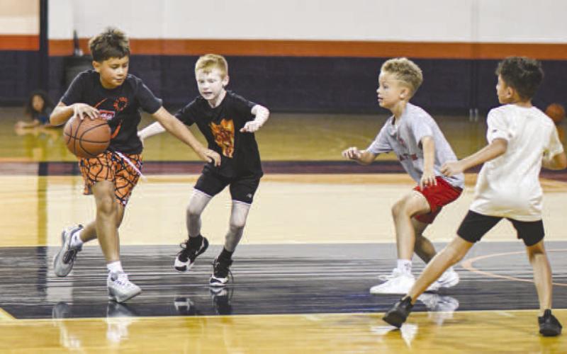 TWO-ON-TWO – Preston Birdwell, Silas Peña, Kyler Dent and Xander Guillen play a basketball game of two-on-two during the Levelland Lobo Basketball Camp at the Texan Dome on August 5. (Staff photo by Jentezen Smith)