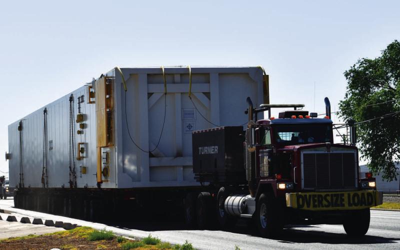 MOSEY ON THROUGH - It was slow going as a semi carrying an oversized load worked its way from Lubbock through Levelland. Traveling on Highway 114 heading west, both highway lanes were halted as the vehicle needed both lanes to safely transport its cargo. Lubbock motocycle units aided in leading the semi through traffic as well as Hockley County and Levelland Police Department units as it made its way through the area Friday afternoon. (Staff Photo by Victoria Byrnes)