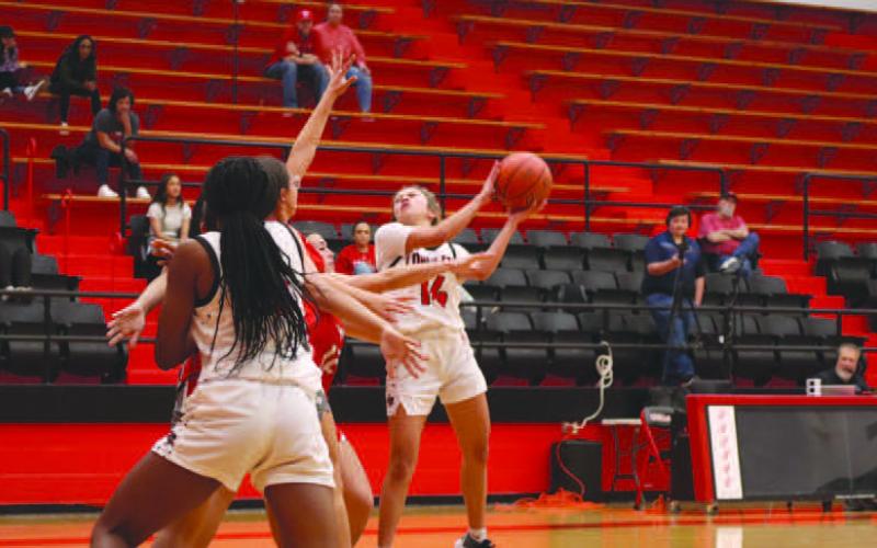 PHYSICAL SHOT - Levelland Loboette Kaylee Penner made the shot against the Denver City Fillies last Monday. (Staff photo by Aalijah Soliz)
