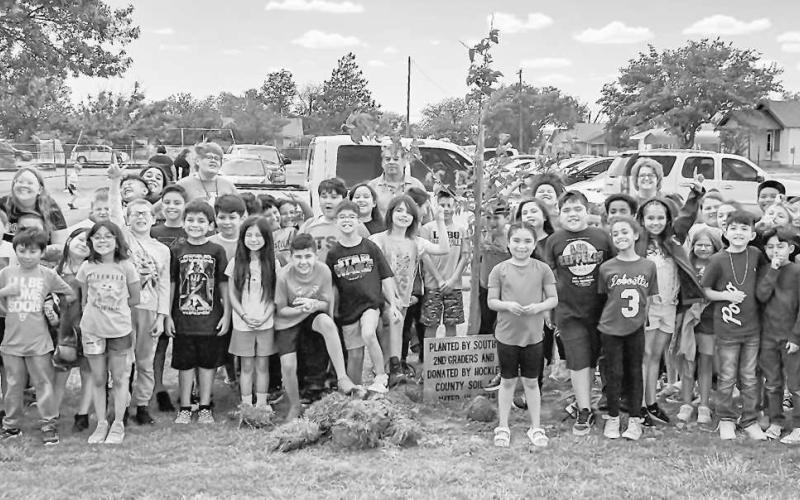 PLANTING A TREE- Second graders at South Elementary had the honor of planting a Fruitless Mulberry Tree on Friday. Every child got to use the shovel and put the dirt around the tree. LISD thanked Mrs. Jessica Kelly and the Hockley County Soil and Water for making the event happen and for adding beauty to the campus. (Photo courtesy of Cristal Isaacks)