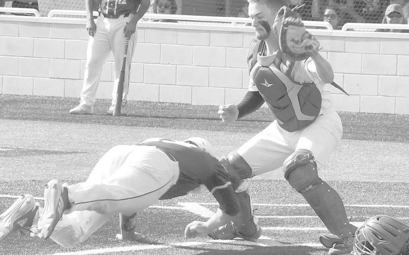 FIRST TEAM CATCHER- Smyer catcher Caleb Clausen went for a tag against an Olton runner in game one of the UIL Class 2A High School Bi-District Playoff against Olton in Littlefield. Clausen was selected as first team catcher for the District 4-2A All-District team. (Photo Courtesy of Jay Kelley)