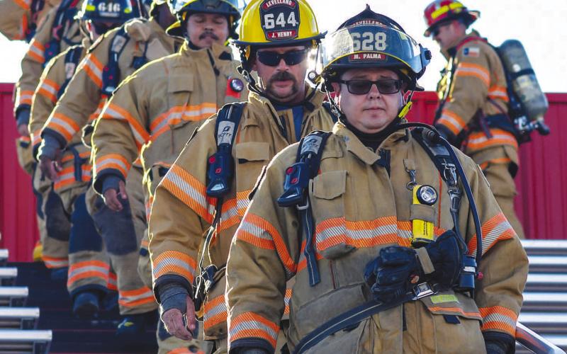 REMEMBERING THOSE LOST - Members of the Levelland Fire Department, Levelland Police Department, Hockley County Sheriff's Office and Texas Highway Patrol participated in the 9/11 Memorial Stair Climb at Lobo Stadium earlier Wednesday. The climb was done to honor those who paid the ultimate sacrifice during the 2001 terror attacks and remember those who were lost. (Staff photo by Dom Puente)