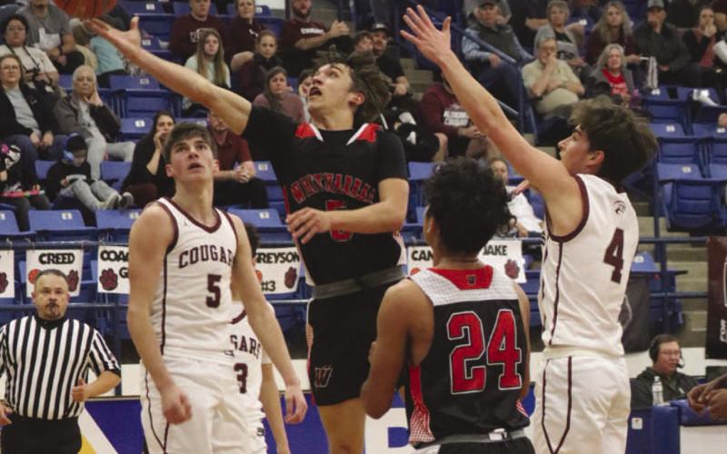 CONTESTED LAYUP - Whitharral Panther Jack Griffin layed the ball up through the contact during the teams game this past Tuesday at Frenship High School. (Staff photo by Aalijah Soliz)