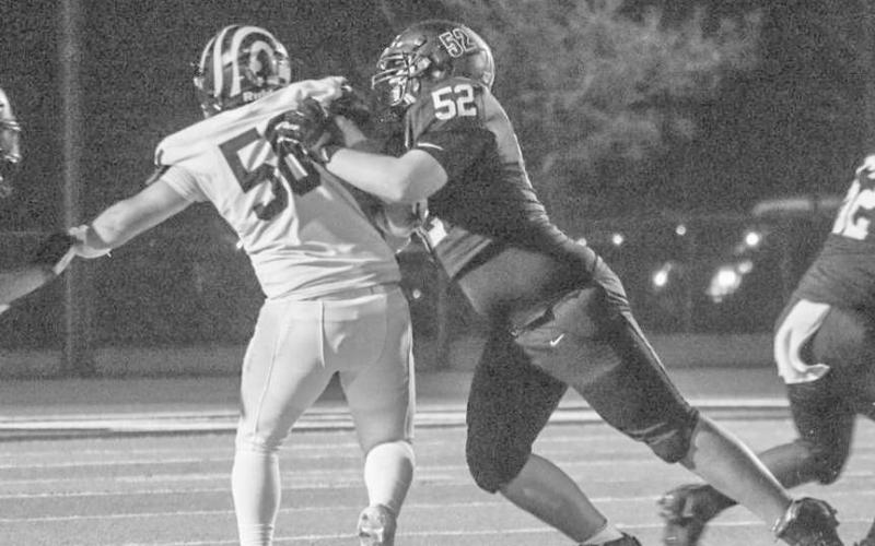 PANCAKE - Levelland Lobo Casen Potter blocked his defender to the whistle this past Friday at home against the Snyder Tigers. (Staff photo by Aalijah Soliz)