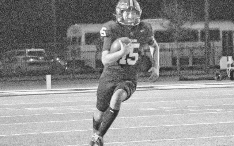QB SCRAMBLE - Levelland Lobo Ethan Salazar escaped the pocket under pressure this past Friday against the Snyder Tigers at home. (Staff photo by Aalijah Soliz)