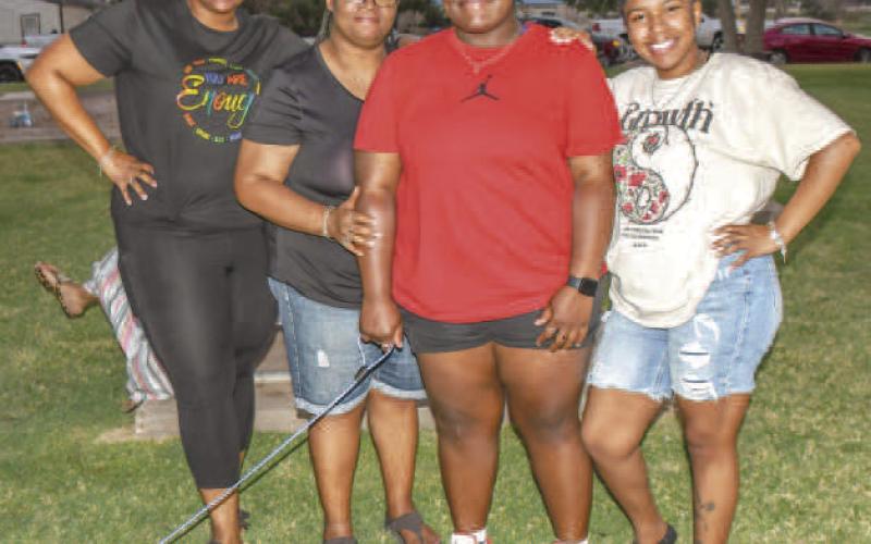 FAMILY FUN - Pictured from left to right are: Jazmine Sanchez, Valerie Dent with her two daughters Geazjia Holland and Nivea Holland enjoying their time at the 35th annual Juneteenth Celebration. The event is held yearly at L.G. Griffin Park in Levelland. (Staff photo by Essence Childers)