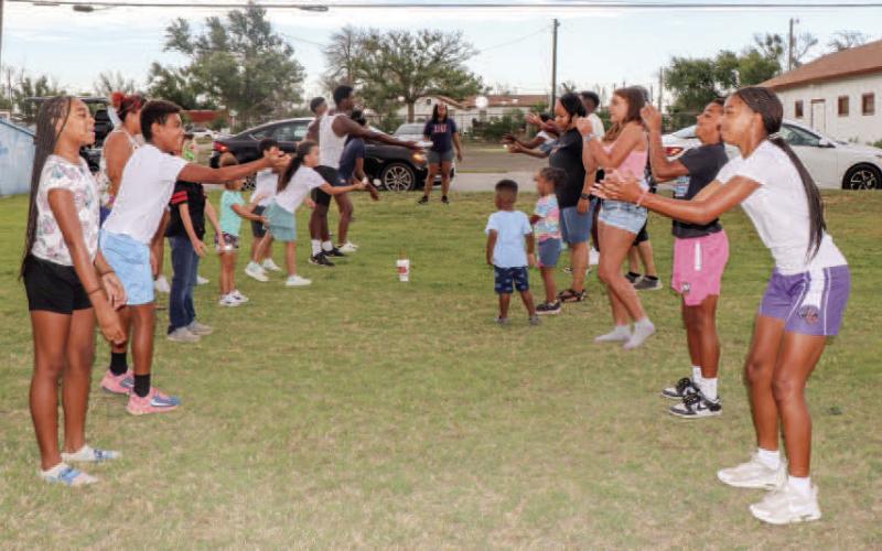 EGG TOSS - Several families returned to Levelland for the 35th annual Juneteenth Celebration Saturday at L.G. Griffin Park. Pictured are participants of the egg toss. Prizes were given to all the participants. (Staff photo by Hannah Woodrum)