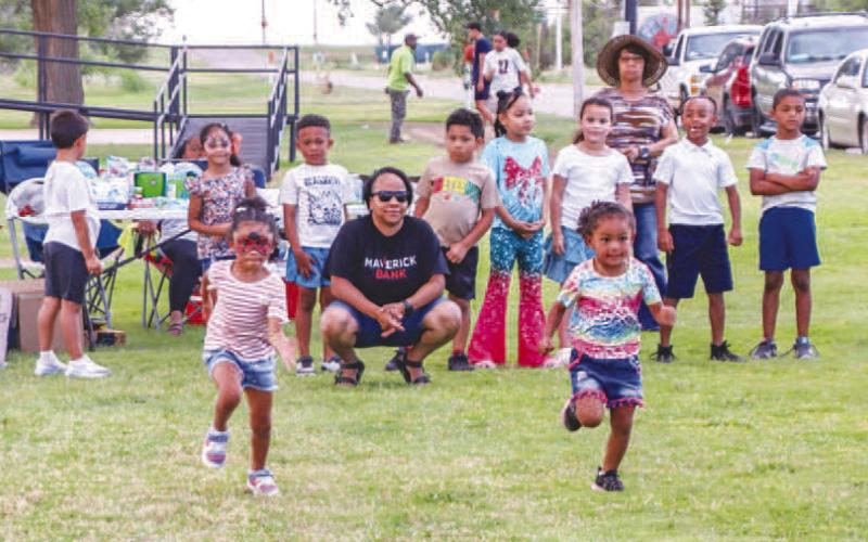 RUNNING FAST - Pictured are two little girls participating in the kids races at the annual Juneteenth Celebration held at L.G. Griffin Park. (Staff photo by Essence Childers)