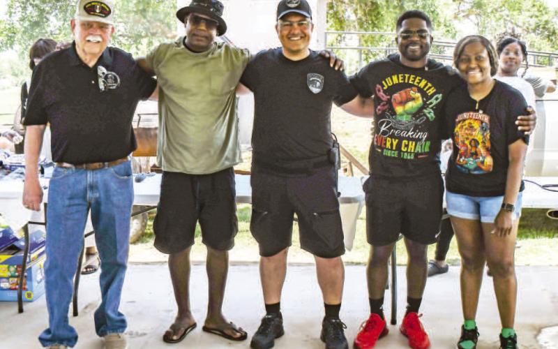 HONORING VETERANS - Several veterans were honored during the annual Juneteenth Celebration this past Saturday at L.G. Griffin Park. Each year veterans are given a pin thanking them for their service. Pictured from left to right are: Bill Powell, Michael Smith, Aaron Corley, Endurance Childers and Joyce Howard. (Staff photo by Essence Childers)