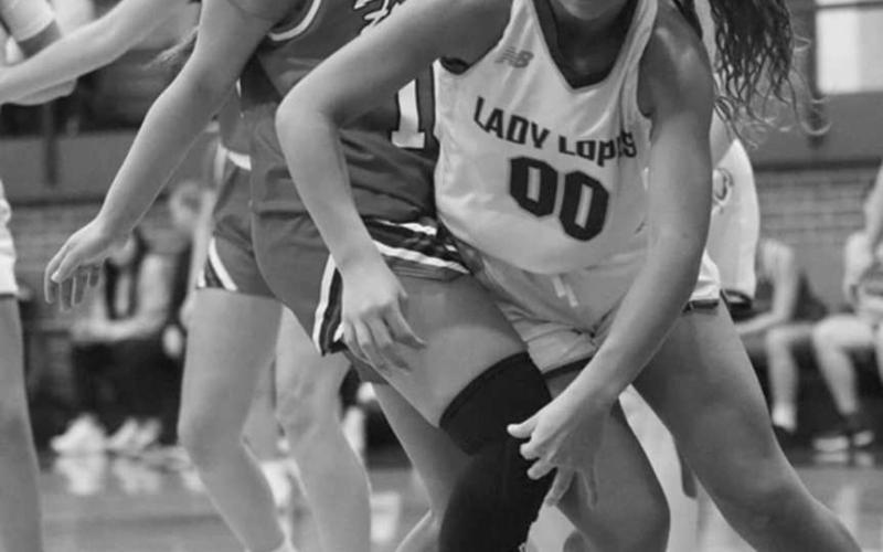 LOOSE BALL - Whiteface’s Lainy Sanders scrapped for a loose ball against Friona in Whiteface’s Way Out West Tournament last weekend. Sanders and the Lady Lopes won the tournament going 5-0. The Whiteface girls will host Segraves Monday at 7 p.m. (Photo by Holly Crutcher)