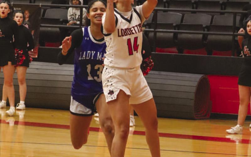 EASY LAY-IN - Levelland Loboette Kaylee Penner layed the ball up during the team’s fastbreak against the Estacado Lady Mats at home. (Staff photo by Aalijah Soliz)
