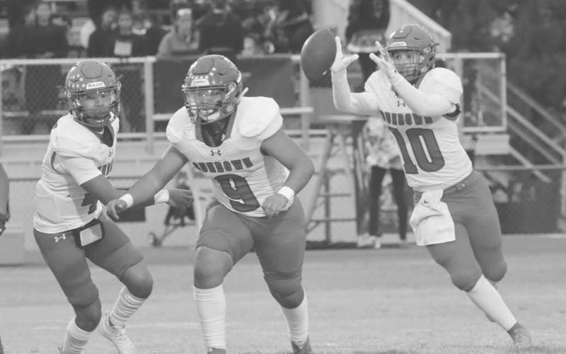 TOSS - Sundown Roughneck Rayden Flores caught the ball for the sweep run to the left this past Friday agains the Plains Cowboys on the road. (Photo courtesy of Sundown ISD)