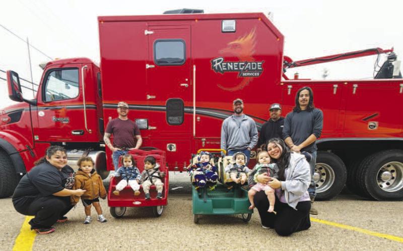 BIG TRUCK DAY-- Renegade participated in Big Truck Day Tuesday morning at Building Blocks and Head Start in Levelland. Josh Lawson, Deven Mendoza, John Garcia and Zach Corgill helped the young students check out the wireline truck. Students pictured are, from left to right: teacher Chlarissa Vargas, Camden Lopez, Sabella Matamoros Magana, Giovanni De La Hoya, Ivy Solis, Jupiter Esteban-Rodriguez, Lillyana Dominguez, and teacher Abrianna Valdez (Submitted Photo)