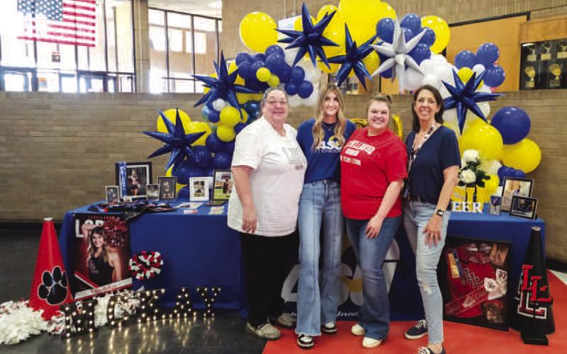 ANGELO STATE CHEER - LHS Senior Cailey McKay signed her letter of intent to cheer for Angelo State University. The signing ceremony was held Thursday in the high school commons. Pictured with McKay are Coaches DeMerritt, Northcutt and Villanueva. (Photo courtesy of Cristal Isaacks)