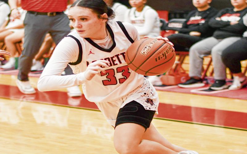 BASELINE DRIVE - Levelland Loboette Presley Smith drives down the baseline during their game against Big Spring this past Tuesday at Levelland High School. Smith would score 10 points in the win. (Staff photo by Jentezen Smith)