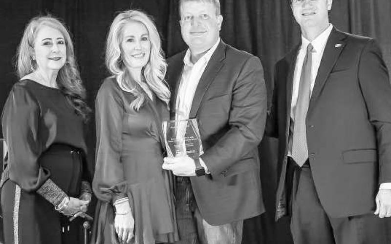 SOUTH PLAINS COLLAGE FOUNDATION - Board President Ann Capps and SPC President Dr. Robin Satterwhite present the 2024 Pacesetter Award to Scott and Jaime Bryant at the College’s 26th Annual Scholarship Gala on Feb. 23 at the Mallet Event Center in Levelland. Pictured from left are Ann Capps, Jaime Bryant, Scott Bryant and Robin Satterwhite. (Photo courtesy of SPC)