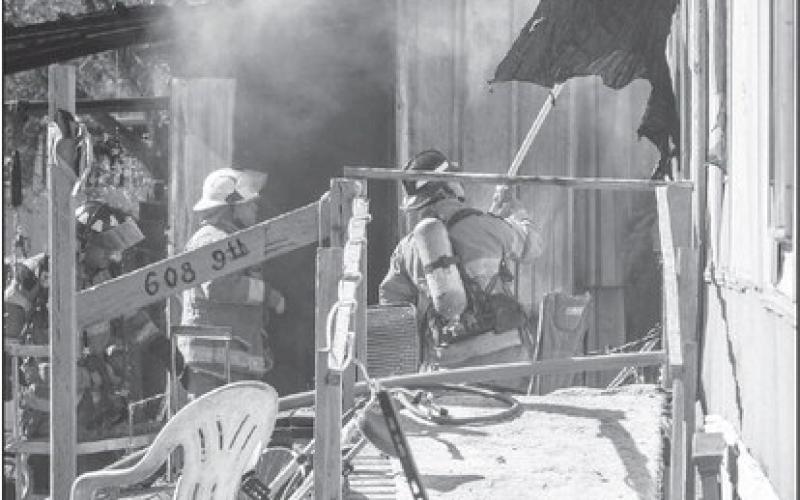 QUICK RESPONSE - The Levelland Fire Department responded to a structure fire in the 600 block of 9th Street Thursday morning. The Levelland Police Department provided traffic detail while fire crews extinguished the flames from a shed located behind the residence. (Staff photo by Dom Puente)