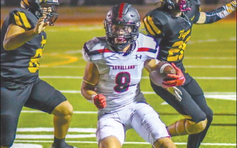 QUICK FEET - Levelland running back Kaden Brogden ran the ball for the Lobos against the Tigers to pick up some much needed yards in the teams loss. Brogden has proven to be one of the bright spots in the Lobo offense through the first two weeks of the schedule. (Staff photo by Dom Puente)