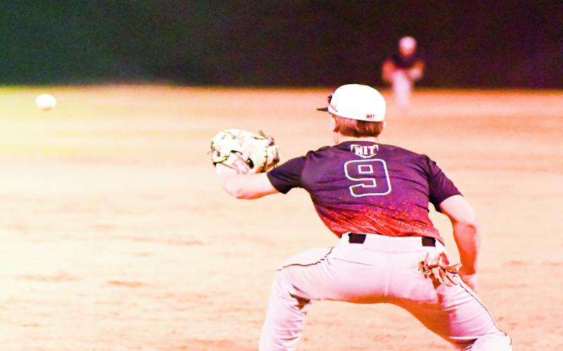 PEMBERTON AT FIRST - Levelland Lobo Kade Pemberton fields the baseball for an out while playing first base during their scrimmage against Seminole this past Friday at Level land High School. (Staff photo by Jentezen Smith)