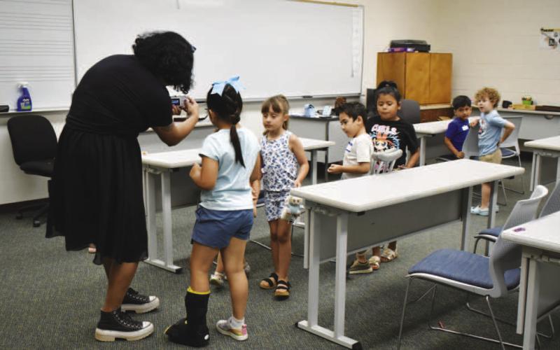 PHOTOGRAPHY CLASS – Pictured are five to six-year-old participants at the SPC Explore the Arts camp last week. Campers had fun taking pictures of each other both indoors and outdoors(Staff photo by Ada Niederhauser)