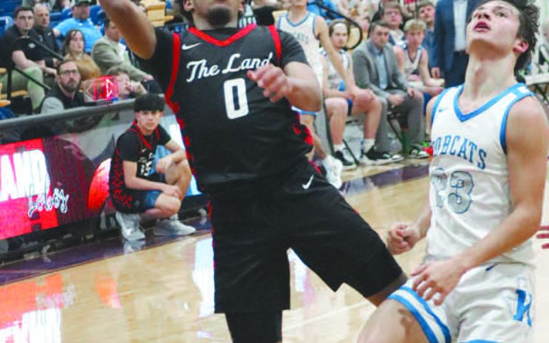 TOUGH SHOT - Levelland Lobo Jayden Castillo layed the ball up during the teams game against the Krum Bobcats this past Friday in Abilene. Jayden earned himself District 5-4AAll District Offensive MVP for his play this season. (Staff photo by Aalijah Soliz)