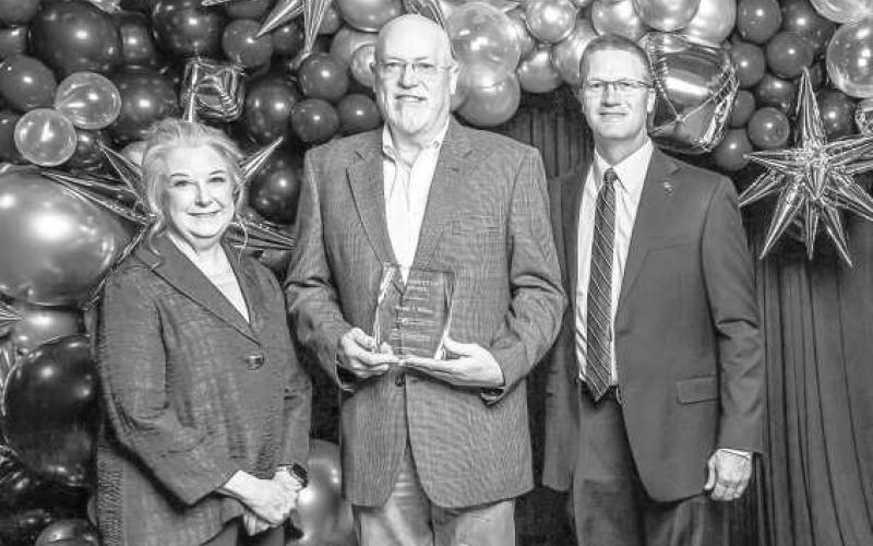 SPC GALA AWARDS -- South Plains College Foundation Board President Ann Capps (left) and SPC President Robin Satterwhite (right) present the 2025 Pacesetter Award to Randy S. Wilson at the College’s 27th annual Scholarship Gala on Feb. 21 at the Mallet Event Center. (SPC Photo)