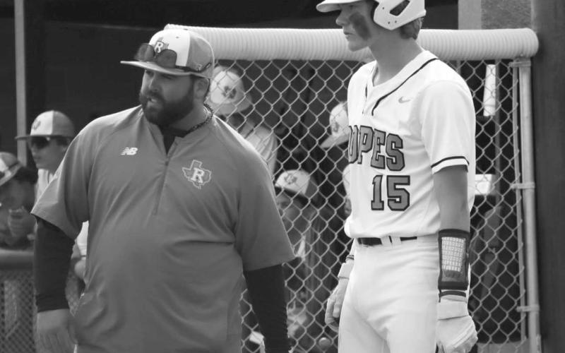 GAMEPLAN - Ropes Eagle Kade Franklin and Head Baseball Coach Blake Jackson talked over their strategy last Tuesday against the Bulldogs. (Staff photo by Aalijah Soliz)