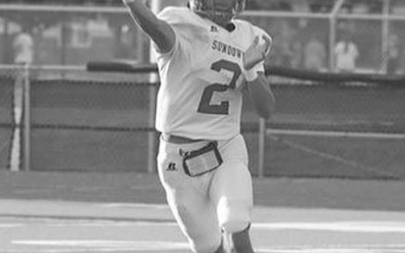 MOBILE - Sundown Roughnecks Adan Escamilla made the throw on the run this past Friday against the Sudan Hornets for the team’s last scrimmage before the regualar season. (Photo courtesy of Sundown ISD)