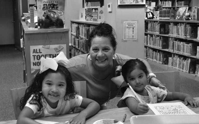 MAKING MEMORIES - Norma Castantino spendt time with her granddaughters Ariel Escobar and Xiomara Escobar at the Hockley County Library. The group participated in the reading program on Wednesday at the Hockley County Library where they enjoyed many activities this summer. (Staff photo by Emily Campos)