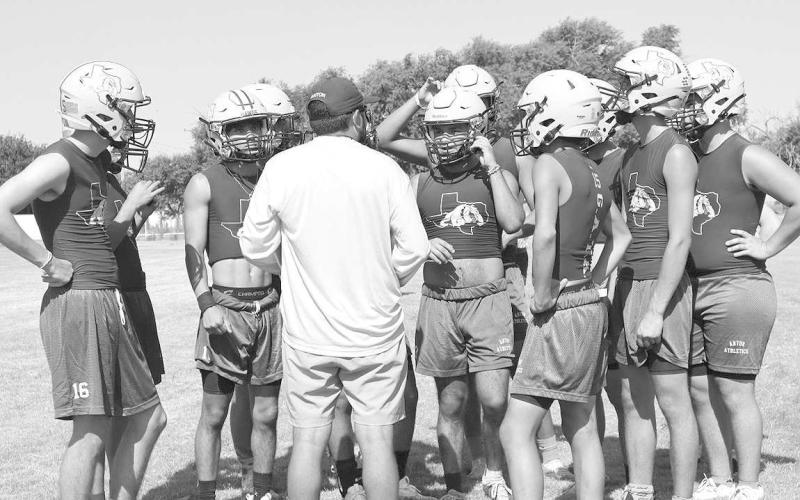END OF PRACTICE - First time Head Football Coach Adam Ramirez talked to his team about the drills they did during practice and what is expected of the team moving forward. Area teams began their first day of two-a-days Monday morning. (Staff photo by Aalijah Soliz)